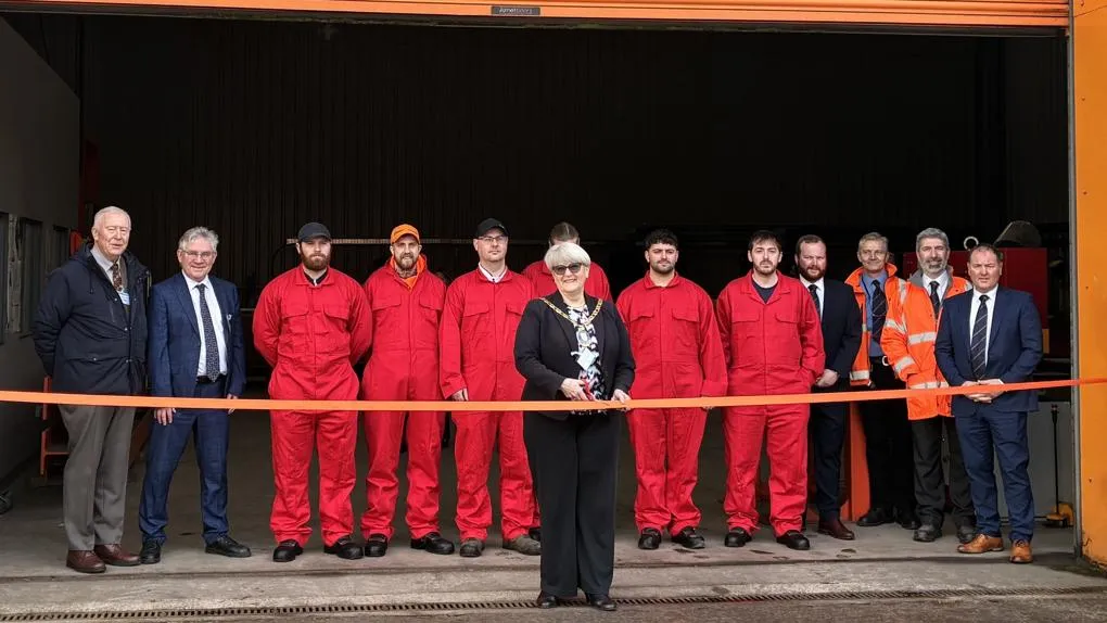Welders, other staff, and North Ayrshire Council members at a ribbon cutting ceremony